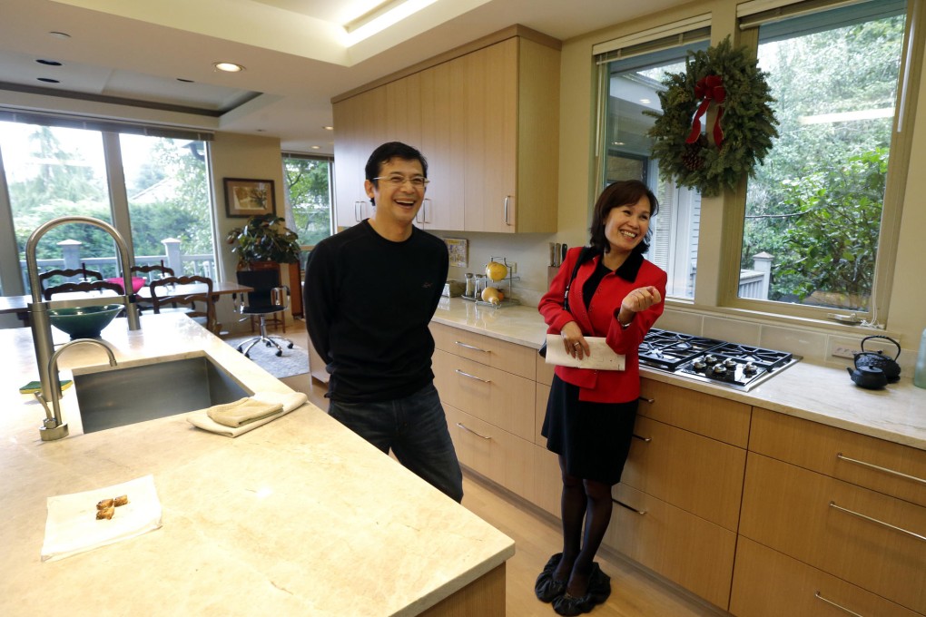 Janie Lee shows a property to her client Wei Hongbin. Photo: AP