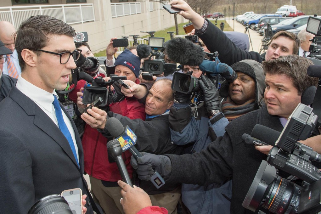 Michael Phelps speaks to the media after his hearing. Photo: AFP