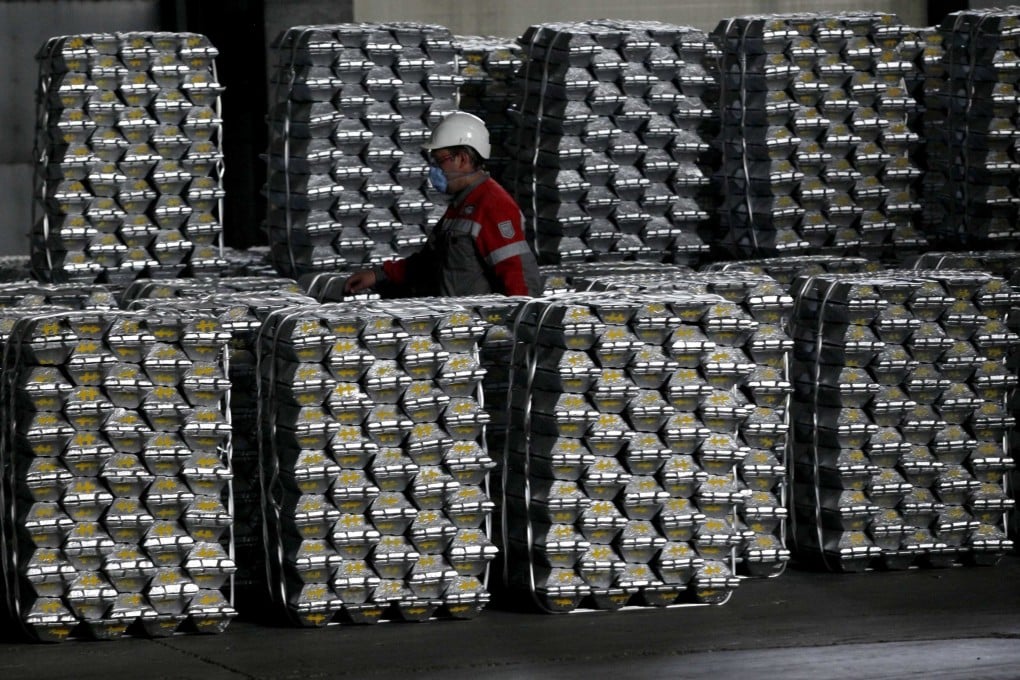An employee marks aluminium ingots at the foundry shop of Rusal. Photo: Reuters