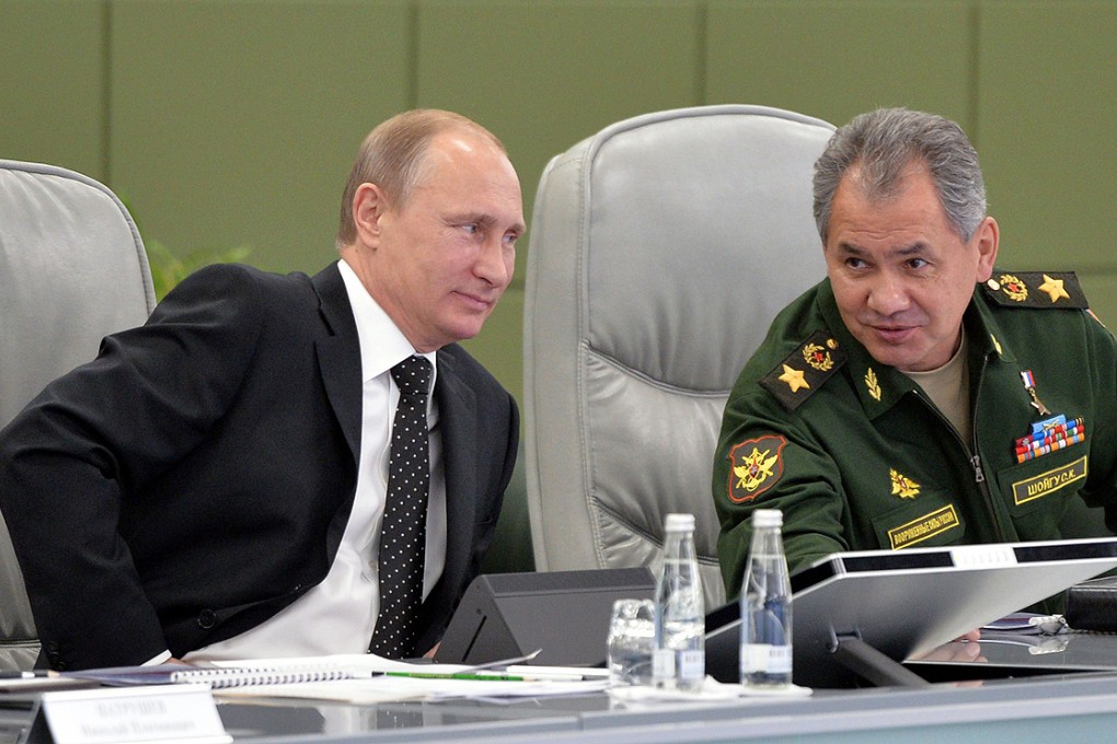 Russia's President Vladimir Putin (left) and Defence Minister Sergei Shoigu at the National Defence Control Centre of the Russian Federation in Moscow on Friday. Photo: AFP