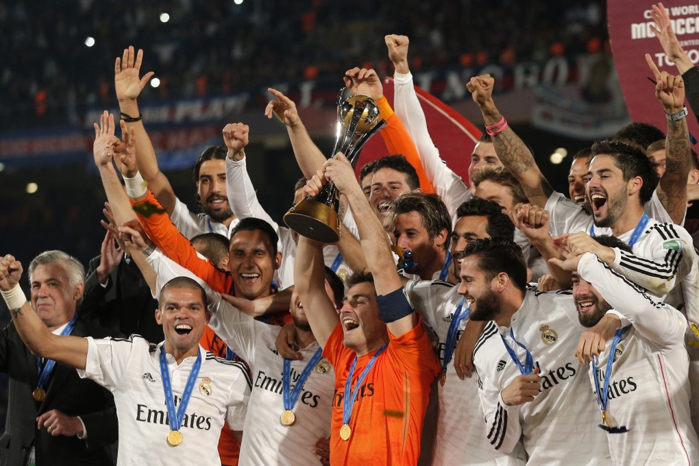 Real Madrid’s Iker Casillas, centre, lifts the trophy alongside team mates. Photo: AP