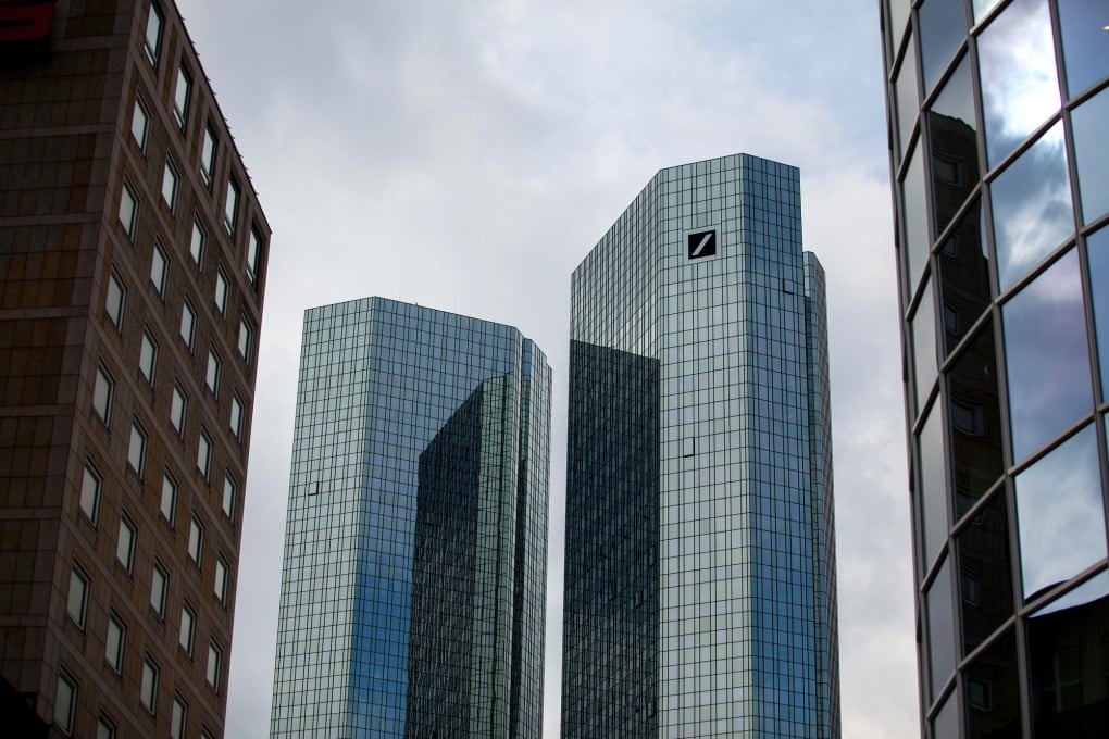 The Deutsche Bank AG logo sits on the company's headquarters in Frankfurt, Germany, on Monday, March 24, 2014. Photo: Bloomberg
