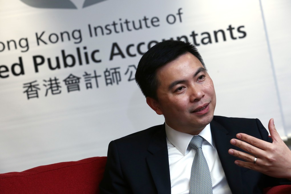 Dennis Ho Chiu-ping, new president of Hong Kong Institute of Certified Public Accountants (HKICPA), poses for a photograph in Wan Chai on December 18, 2014. Photo: Jonathan Wong