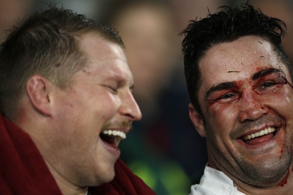 England team-mates Dylan Hartley (left) and Brad Barritt share a joke as they sit on the bench during the autumn international against Australia. Hartley could be banned until after the 2015 Six Nations have started after he was sent off in the English Premiership last weekend. Photo: AFP
