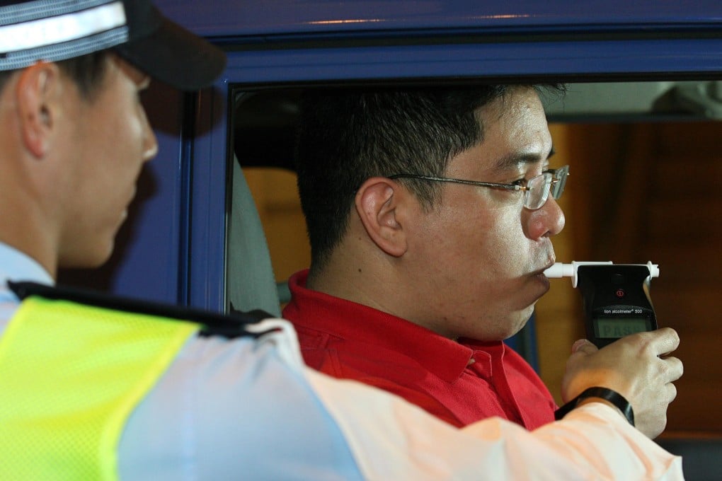 Police carry out a breathalyser test on a driver. Photo: Dickson Lee