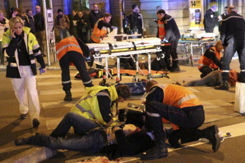 Rescue workers tend victims after who were deliberately run over in Dijon, central France. Photo: AP