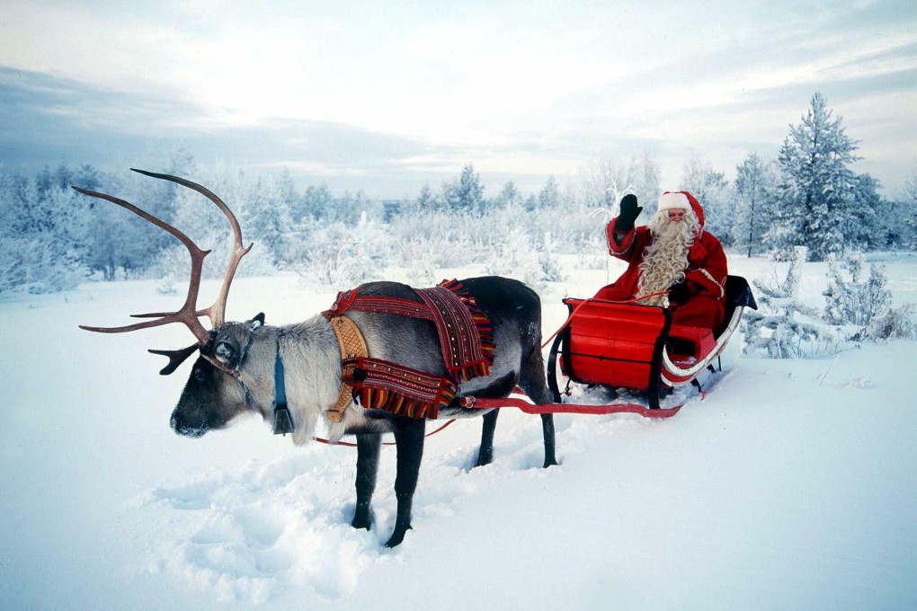Santa Claus, pictured riding in his sleigh pulled by a reindeer in northern Finland. Photo: Reuters