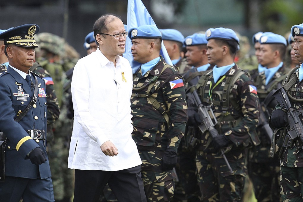 President Benigno Aquino inspects troops in Quezon city last week. Photo: Reuters