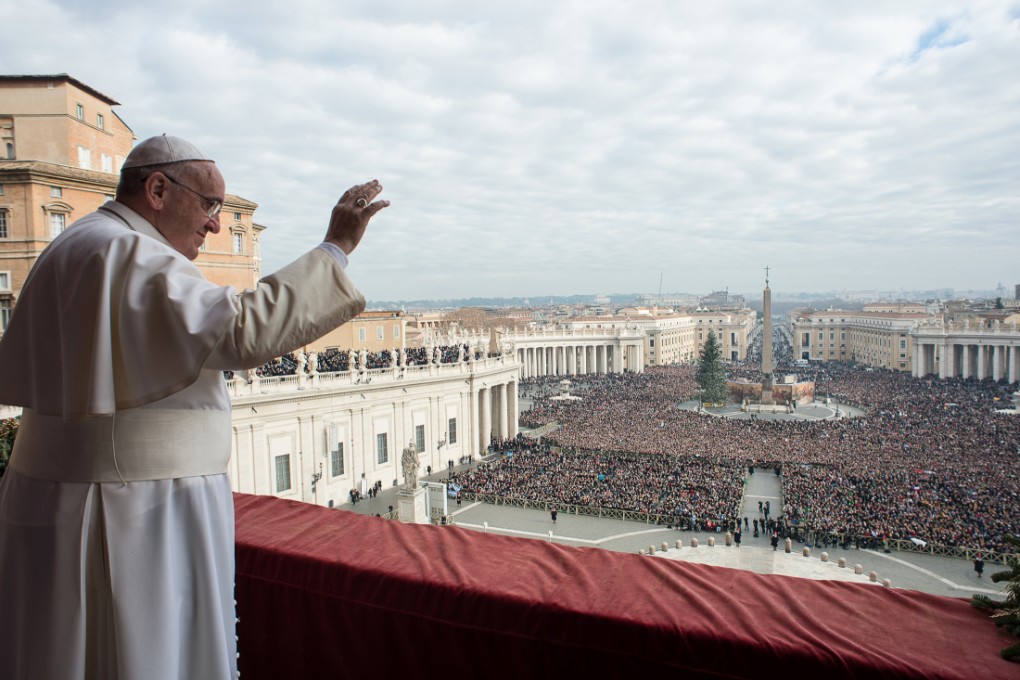 Pope Francis delivers his "Urbi et Orbi" (to the city and to the world) blessing from the central balcony of St. Peter's Basilica at the Vatican. Photo: AP