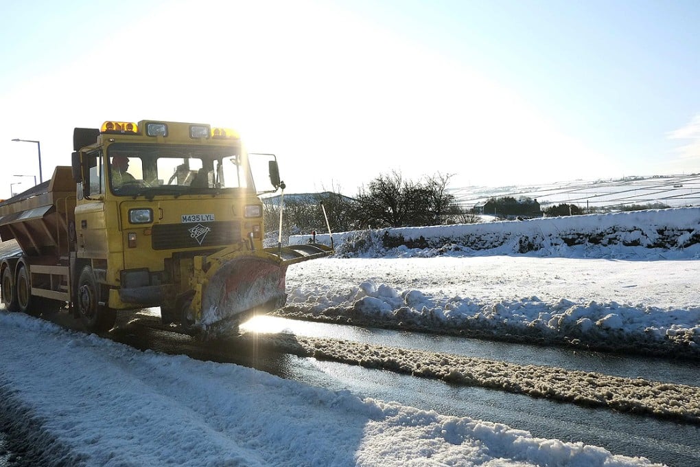 A snow plough clears a road near Sheffield, Yorkshire in northern England on Saturday. Photo: Reuters