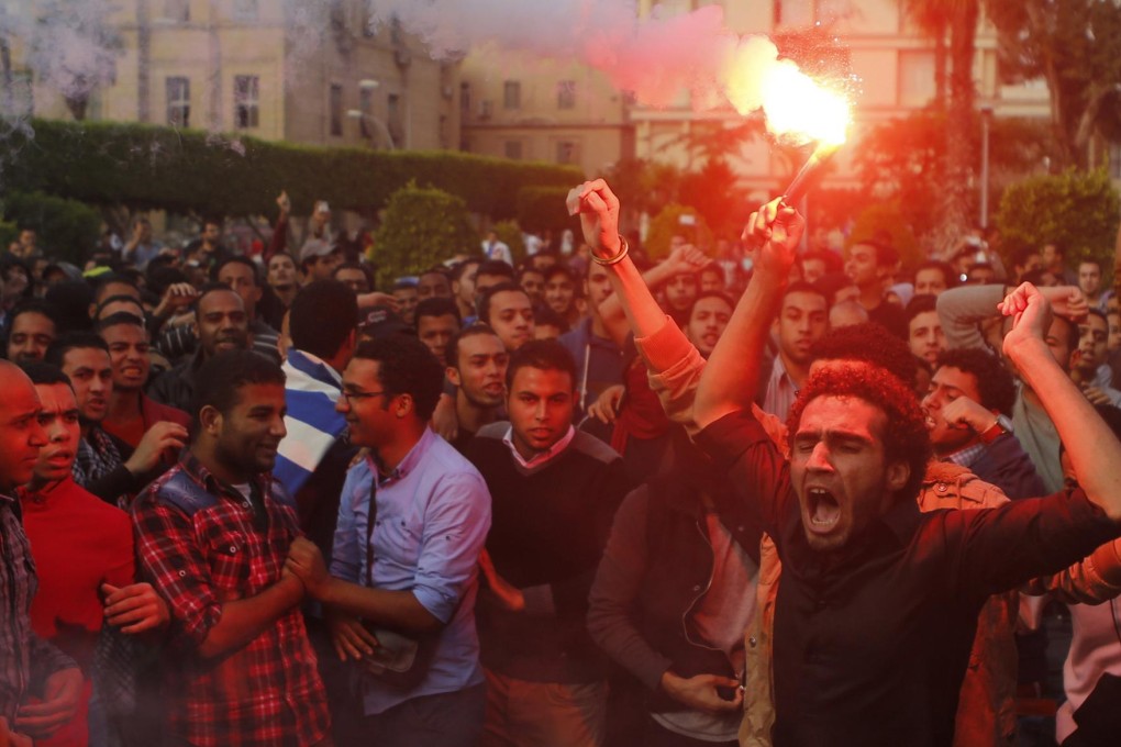 Cairo University students protest last month after charges against former president Hosni Mubarak were dropped. Photo: Reuters