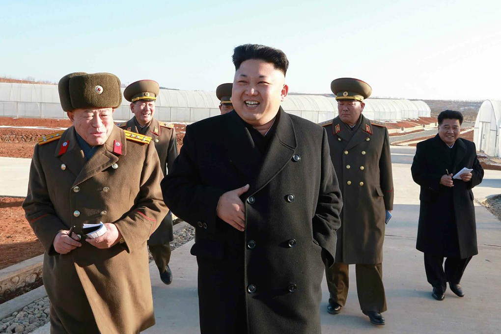 North Korea's supreme leader Kim Jong-un visits a greenhouse for growing vegetables accompanied by military top brass. Photo: EPA