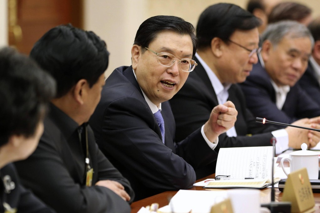 Zhang Dejiang (third from left), chairman of the NPC Standing Committee, takes part in a panel discussion on Saturday. Photo: Xinhua