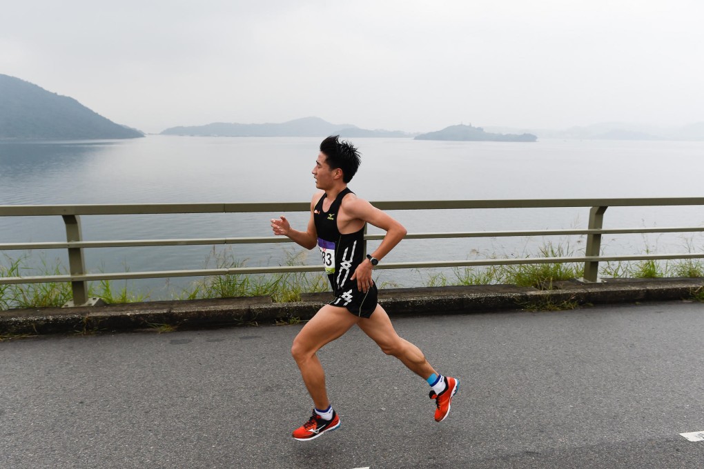 Wang Kun sets the pace at the 17km mark of the Mizuno Hong Kong Half-Marathon. Photo: Richard Castka