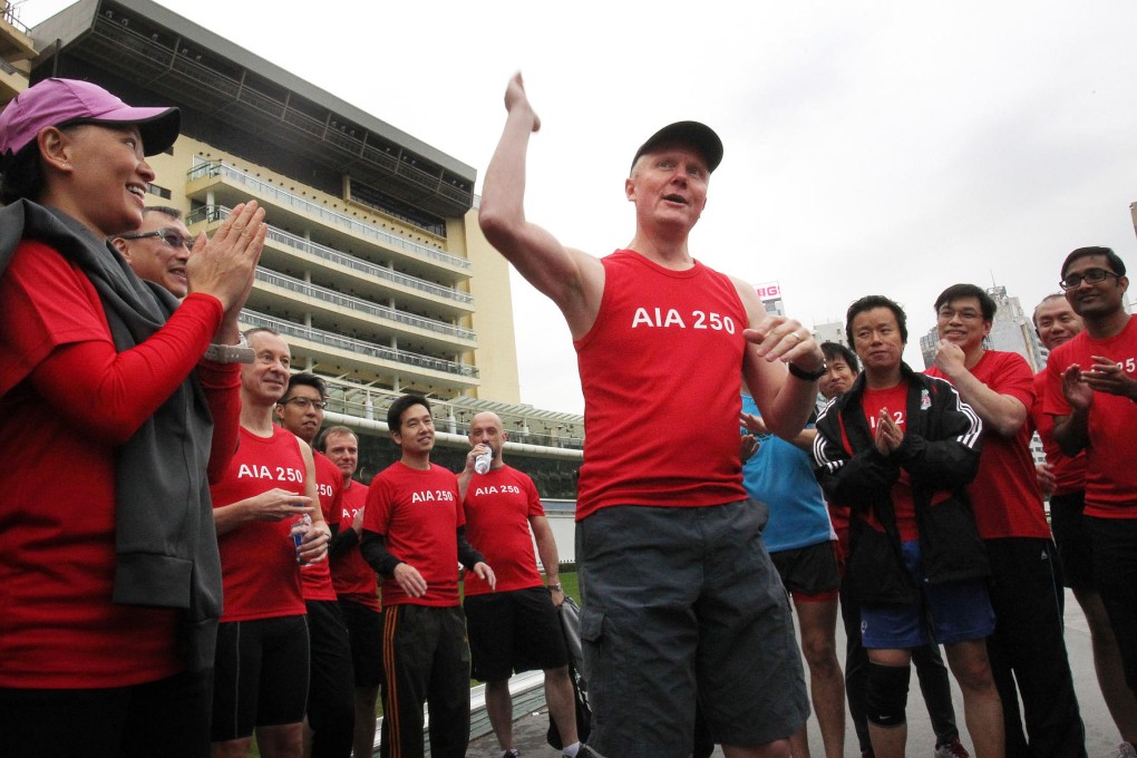 AIA Group chief operations officer Simeon Preston (centre) joined in the run. Photo: May Tse