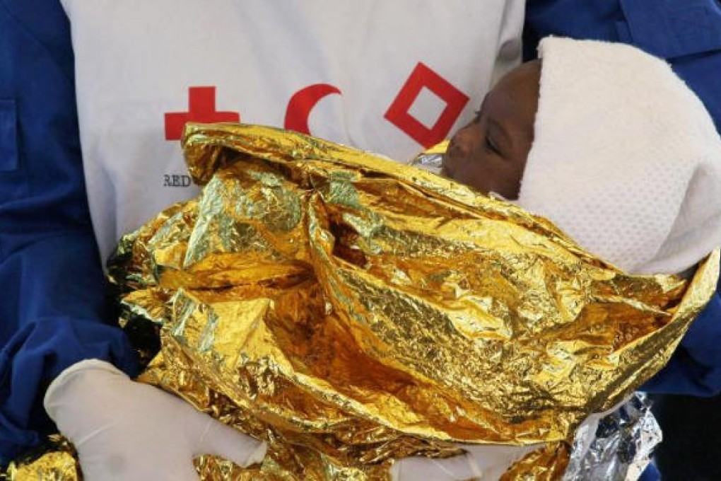 Baby born at sea to Nigerian mother.Photo: SCMP Pictures