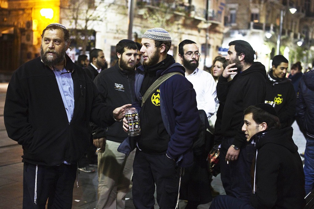 Benzion Gopshtein (left), leader of the far-right Israeli group Lehava, with fellow activists in Jerusalem on Thursday. Photo: Reuters