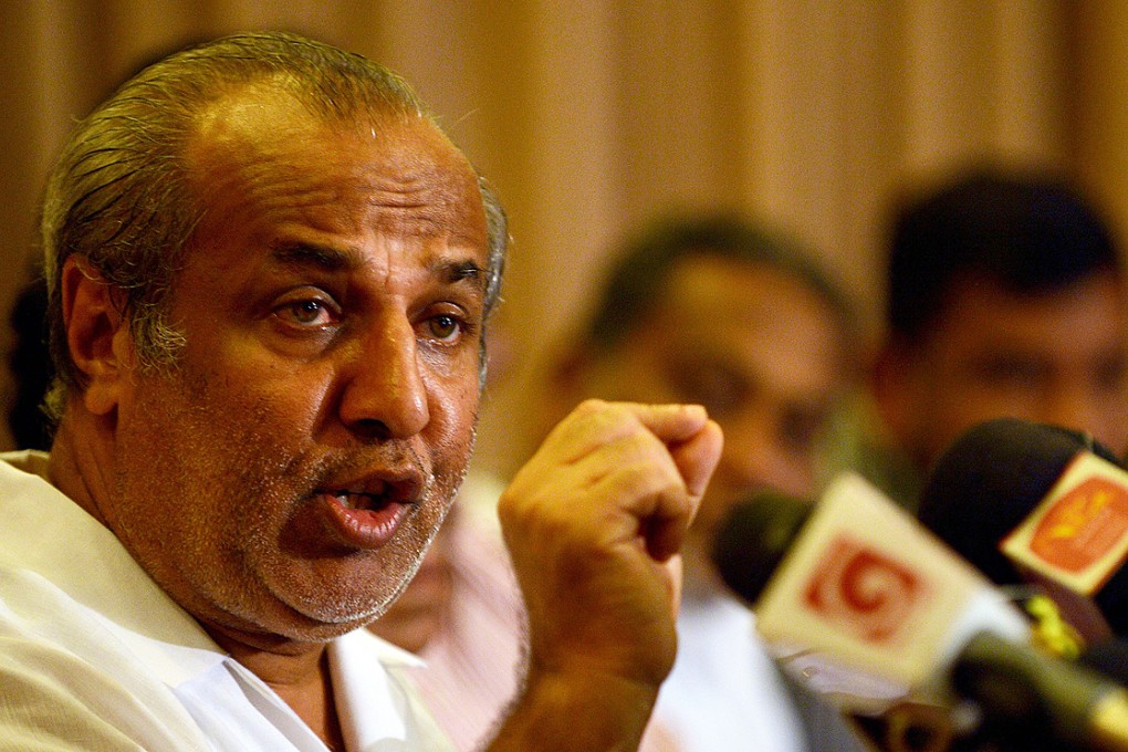 Sri Lanka Muslim Congress leader Rauf Hakeem announces his resignation as justice minister and pledges support for opposition leader Maithripala Sirisena in January 8 elections. Photo: AFP