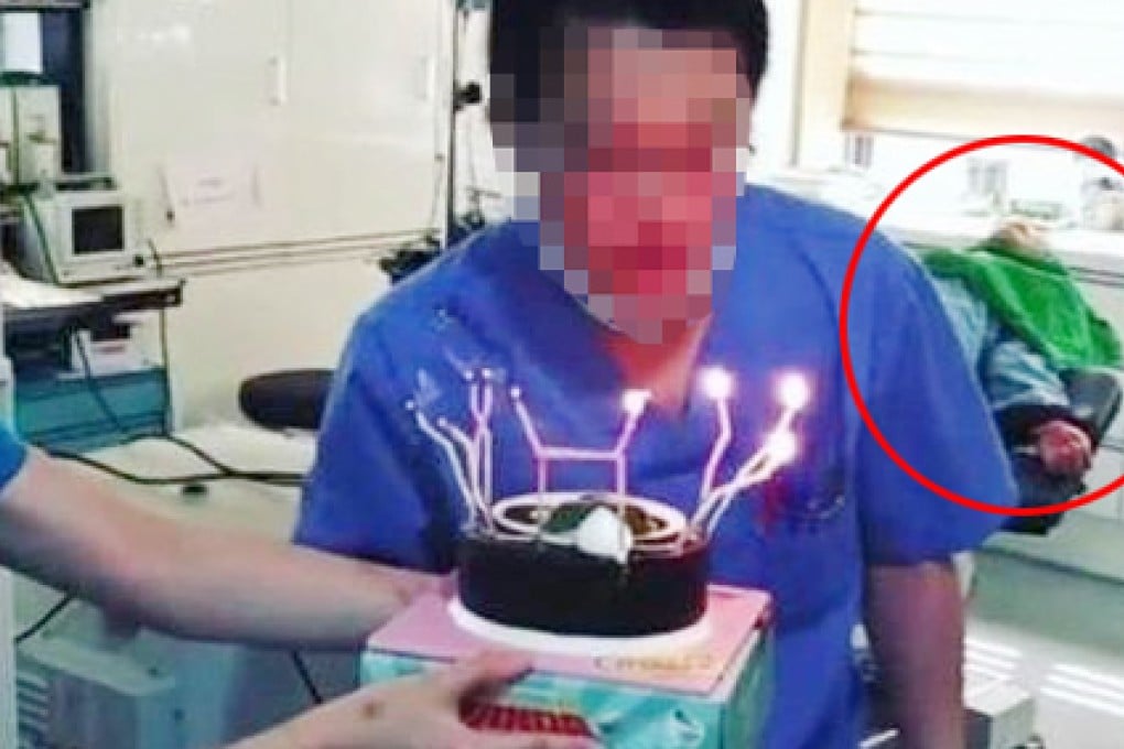 One of the staff blows out a birthday cake while an unconscious patient is lying on the operating table. Photo: Donga News website