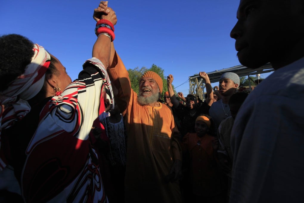 Ben Ammi Ben Israel (centre), the spiritual leader of the African Hebrew Israelites of Jerusalem, is greeted by the crowd during festivities marking the holiday of Shavuot in the southern Israeli town of Dimona. Photo: AP
