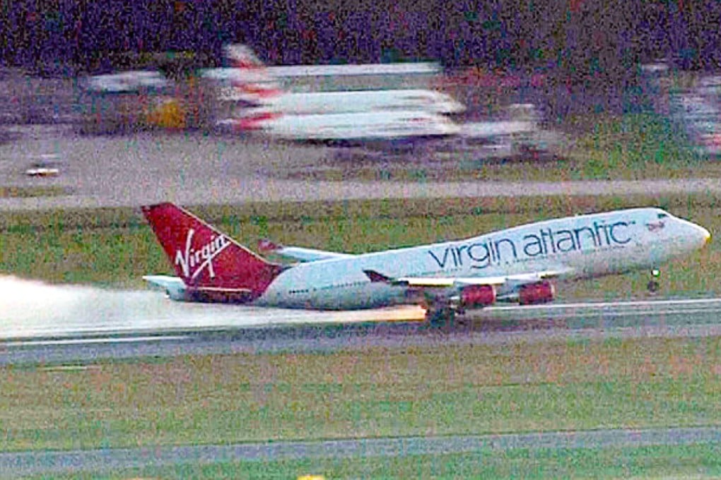 Sparks can be seen coming from the undercarriage as the plane lands at Gatwick Airport. Photo: Screenshot