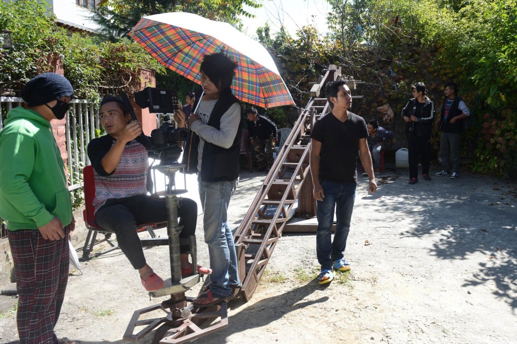 A Bhutanese crew take a break from filming in Thimphu. Photo: AFP