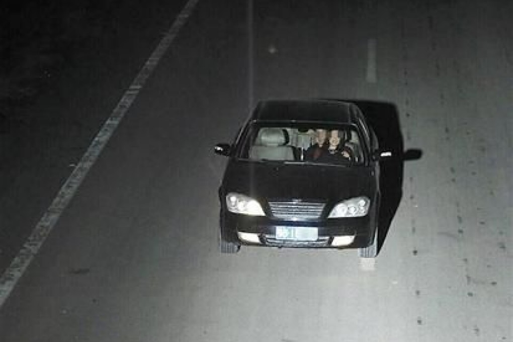 A Hubei driver has been fined 200 yuan after he was caught with a woman on his lap while driving. Photo: SCMP Pictures