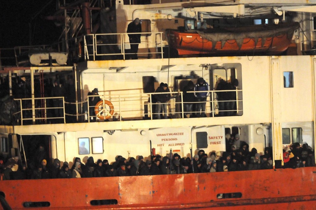 Cold and terrified, the mostly Syrian refugees pack the decks of the Blue Sky M cargo ship at Gallipoli harbour. Photo: Reuters