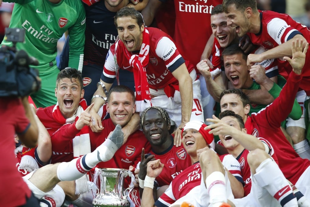 Arsenal players celebrate winning the FA Cup final last year after defeating Hull. The two teams meet again in the third round. Photo: Xinhua