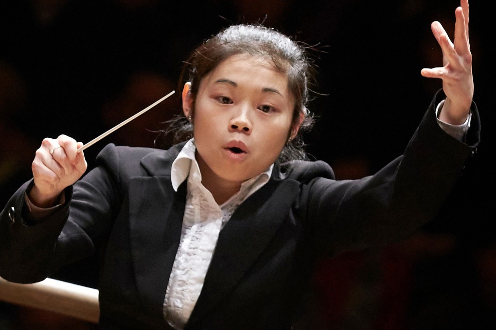 Chan conducts the London Symphony Orchestra in the final of the Donatella Flick LSO Conducting Competition. Photo: Clive Totman