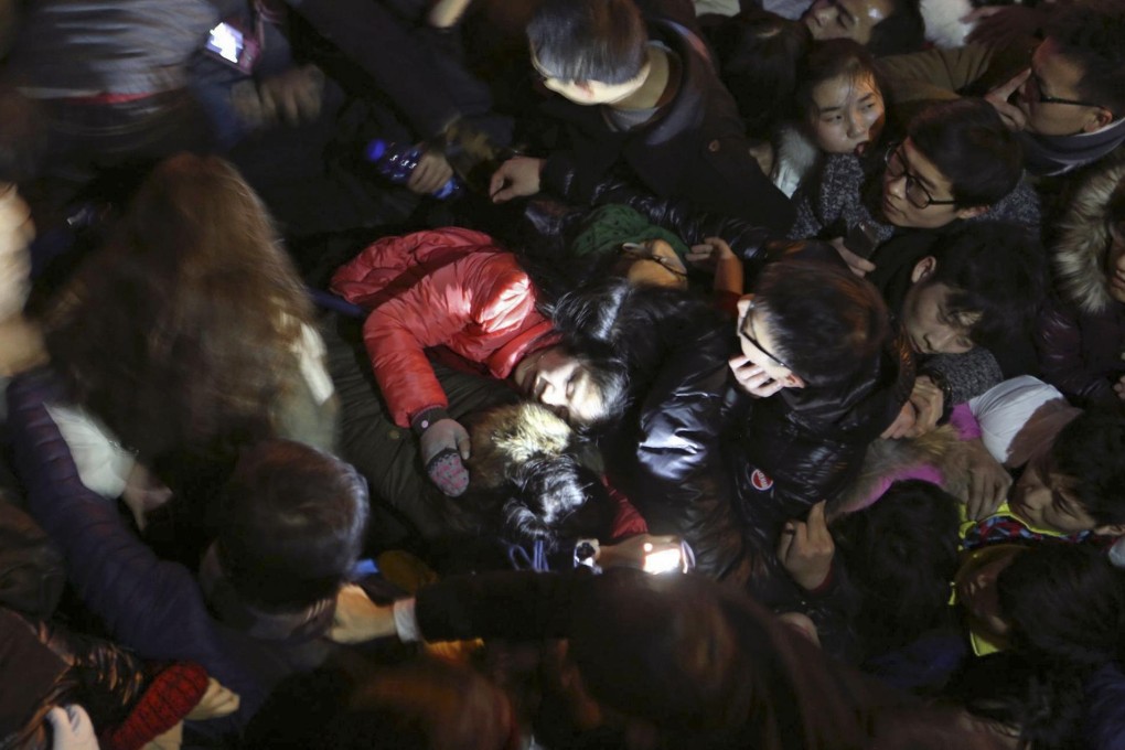 Revellers try to escape the crush in Shanghai. Photo: Reuters