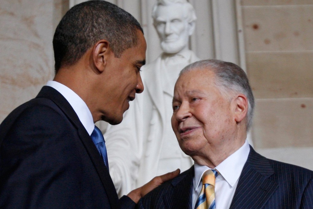 US President Barack Obama congratulates Congressional Gold Medal honoree Brooke. Photo: Reuters