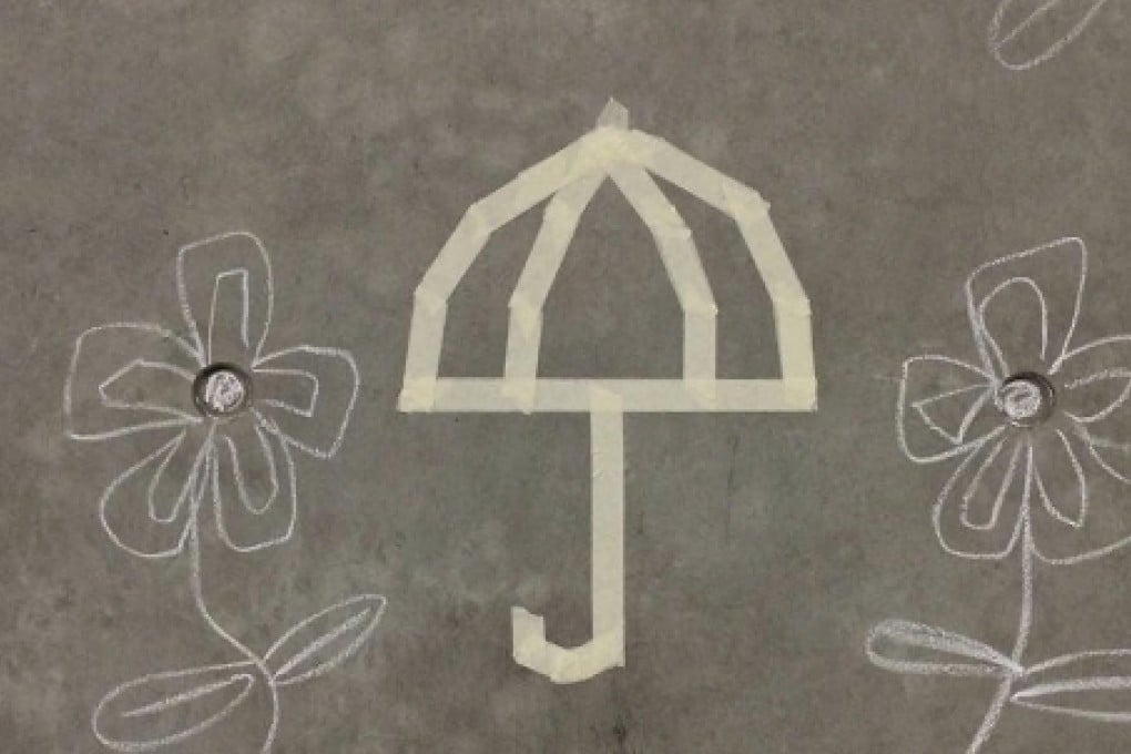 The chalked flowers were drawn around an Occupy umbrella symbol. Photo: SCMP
