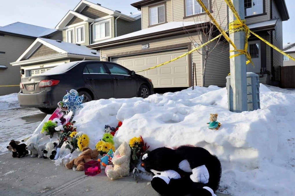 A makeshift memorial at the home where seven persons were found dead in Edmonton. Photo: Reuters
