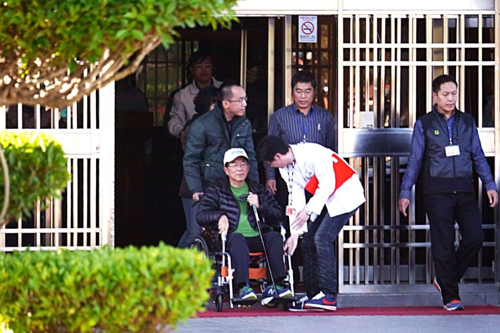 Former Taiwanese president Chen Shui-bian leaves Taichung Prison, pushed by his son, Chen Chih-chung. Photo: CNA