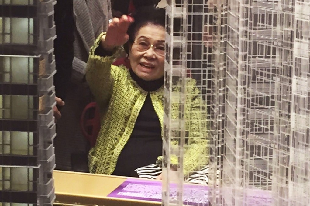Matriarch Kwong Siu-hing sits in a wheelchair at the showroom for flats which are on sale in Tung Chung. Photo: SCMP