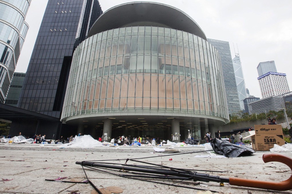 A broken umbrella is seen outside the Legislative Council after the removal of the last protesters camped outside the LegCo during the Occupy Central and Umbrella Movement in Hong Kong. Photo: EPA