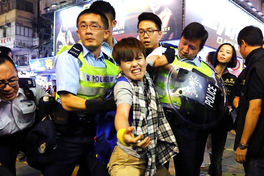 Police officers clash with pro-democracy protesters during clearance operation on Nathan Road in Mong Kok. Photo: Sam Tsang
