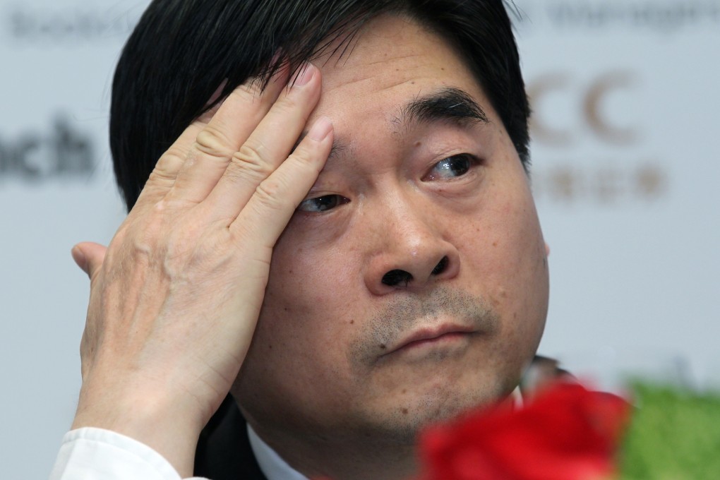 Future Holdings chairman Wang Zhenhua wipes his forehead as his company plans to develop 40 commercial properties over the next three years. Photo: Edward Wong