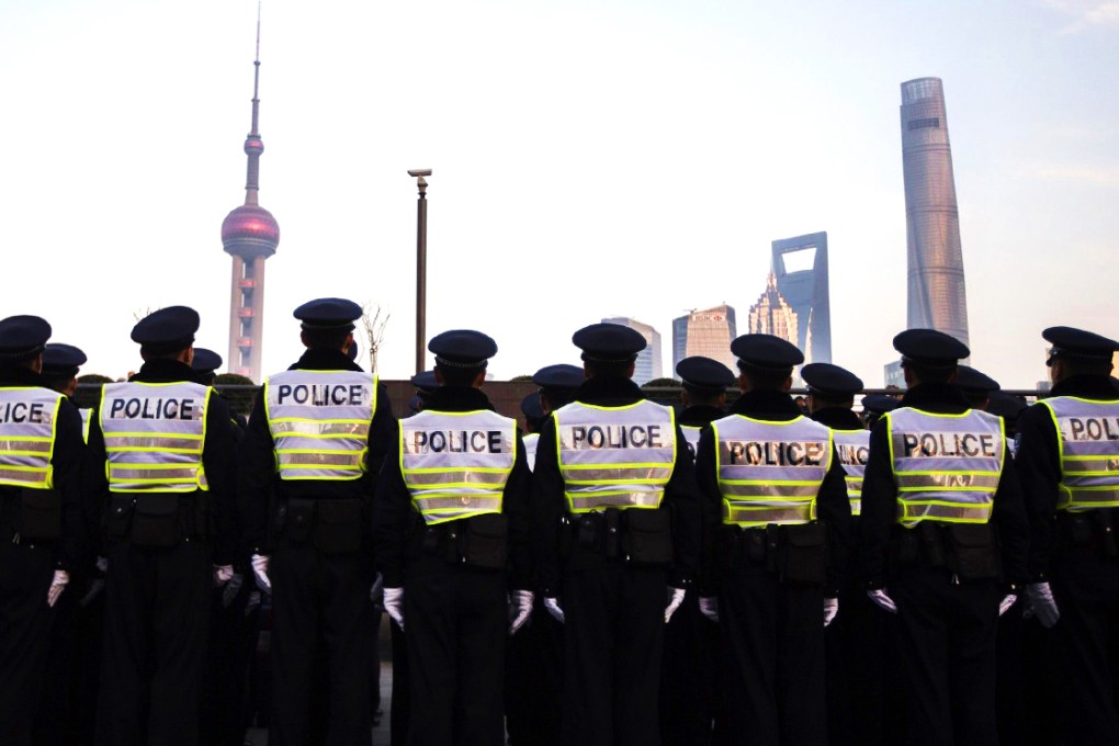 Policemen guard the Bund in Shanghai, where 36 people died in a stampede last week. Photo: Reuters