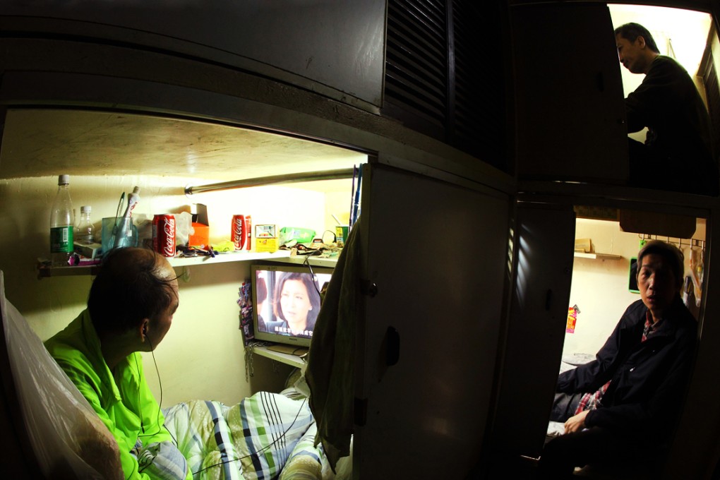 Residents live in a 1.49 cubic meter "coffin" rooms in Mong Kok which cost $1400 a month. Photo: Dickson Lee