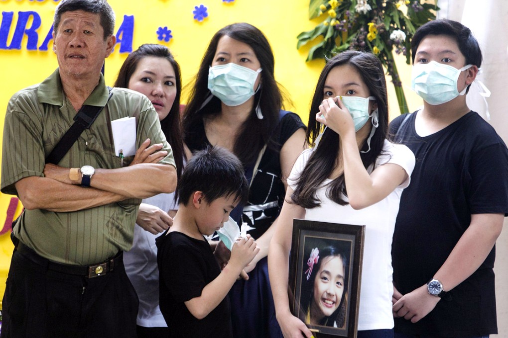 Extended family in Surabaya mourn for Meiji Thejakusama, who joked she would spend her birthday alone at sea. Photo: EPA