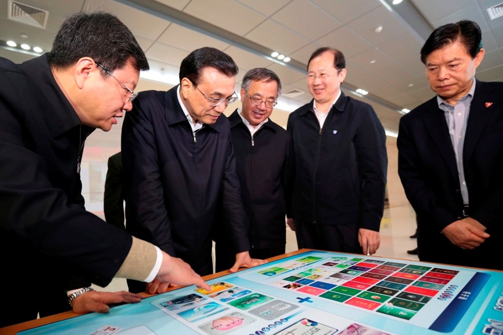 Premier Li Keqiang (2nd left) visits Nansha New Area of Guangdong Free Trade Zone in Guangzhou. Photo: Xinhua