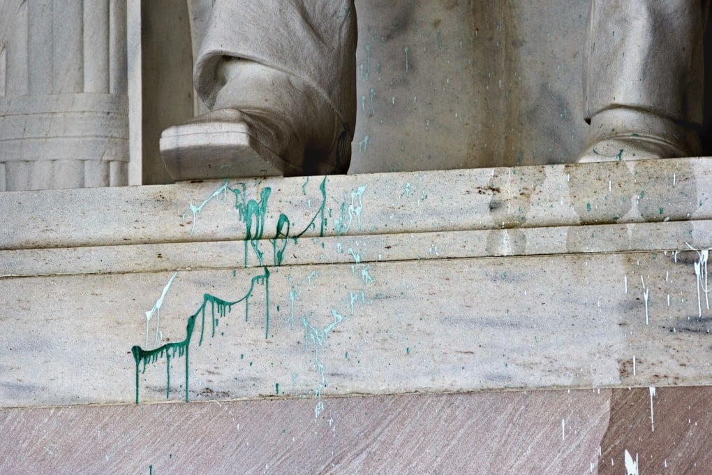 In this July 26, 2013, file photo, green paint is shown splattered on the base of the statue of Abraham Lincoln at the Lincoln Memorial in Washington. Jiamei Tian was suspected of having carried out the vandalism. Photo: AP