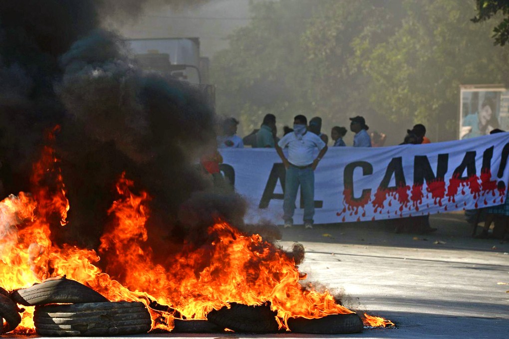 Demonstrators burn tyres in Rivas last month to protest against the Nicaragua Canal. Photo: AFP