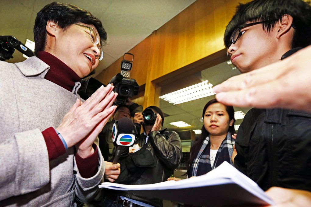 Joshua Wong (right) confronts Chief Secretary Carrie Lam. Photo: SCMP Pictures
