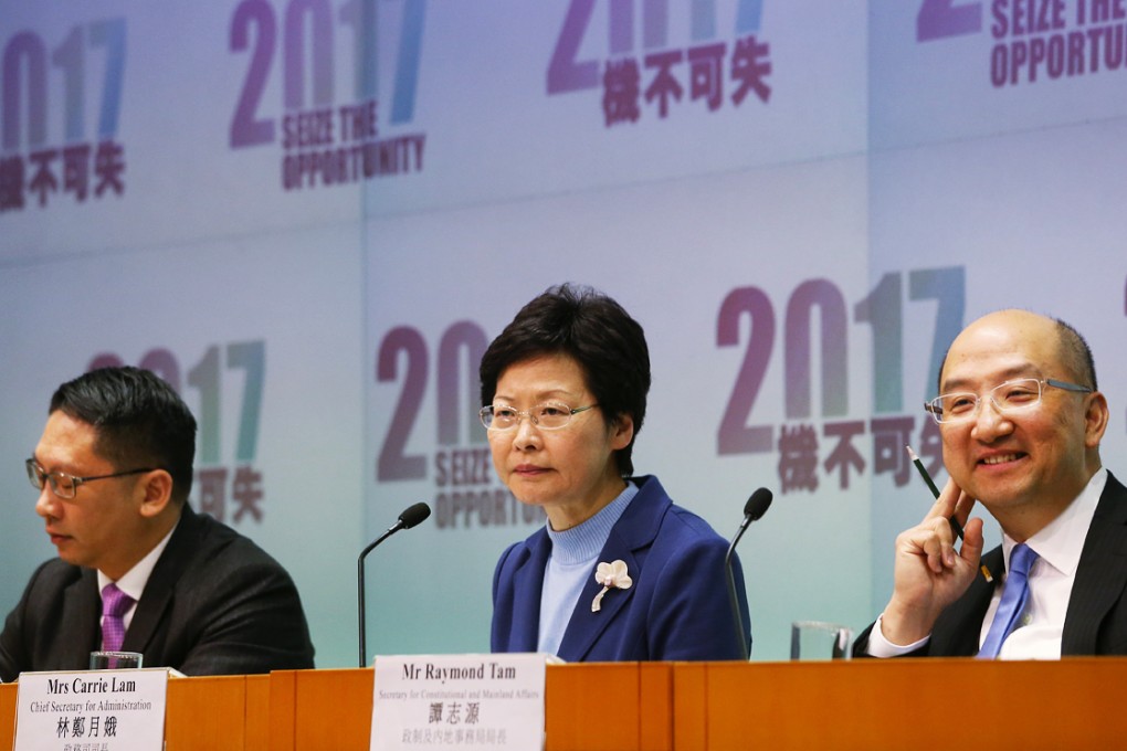 (From left) Secretary for Justice Rimsky Yuen Kwok-keung, Chief Secretary Carrie Lam Cheng Yuet-ngor and Secretary for Constitutional and Mainland Affairs Raymond Tam Chi-yuen attend a press conference to promote the government's controversial second round of public consultation on the method for selecting the Chief Executive of Hong Kong by universal suffrage on January 7, 2015. Photo: David Wong