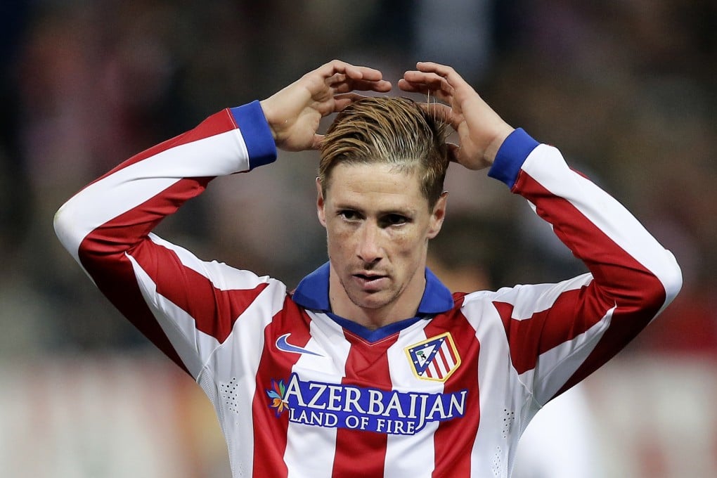 Fernando Torres was greeted like a hero by the Atletico Madrid fans. Photo: AP