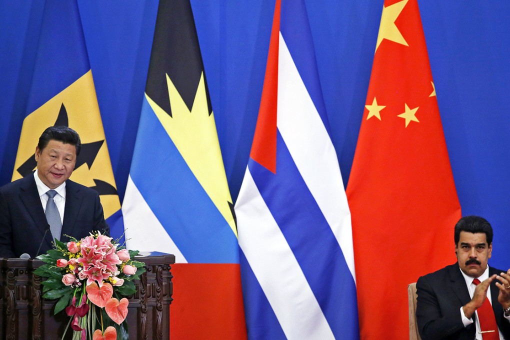 Venezuela's President Nicolas Maduro (right) claps while China's President Xi Jinping speaks during the opening ceremony of the 1st Ministerial Meeting of China-CELAC Forum at the Great Hall of the People in Beijing. Photo: Reuters