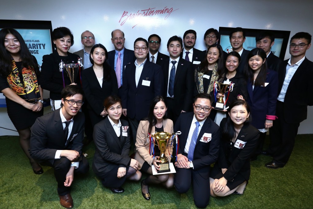 Winners and judges of the MBA Challenge, part of Operation Santa Claus, are pictured at an event held at Swire Properties’ Blueprint office space in Quarry Bay. Photo: Jonathan Wong
